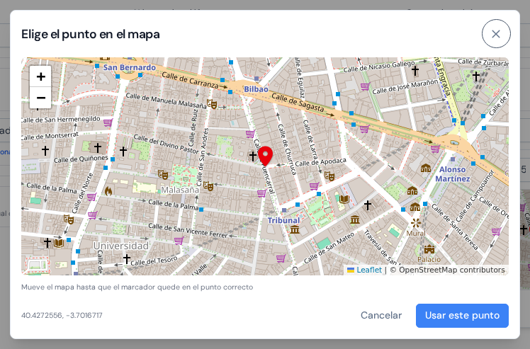 La ventana Elige el punto en el mapa con un mapa de calles, el marcador fijo en el centro y el botón Usar este punto